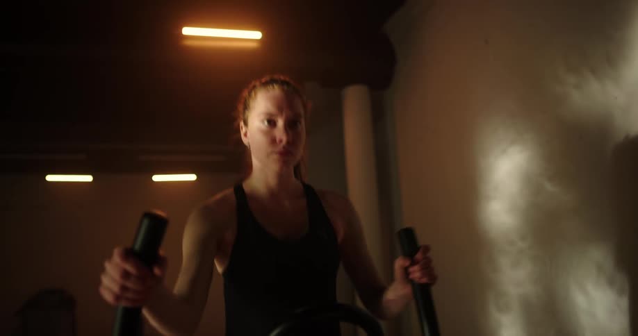 A woman exercising on a machine