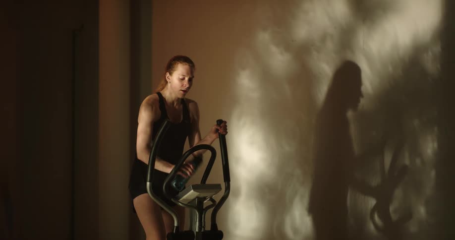 A woman exercising on a machine