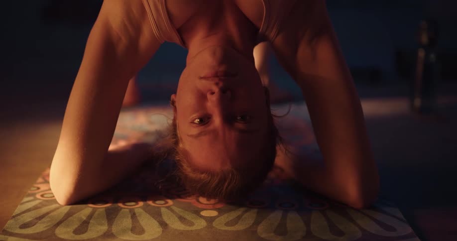 A woman stretching in a room