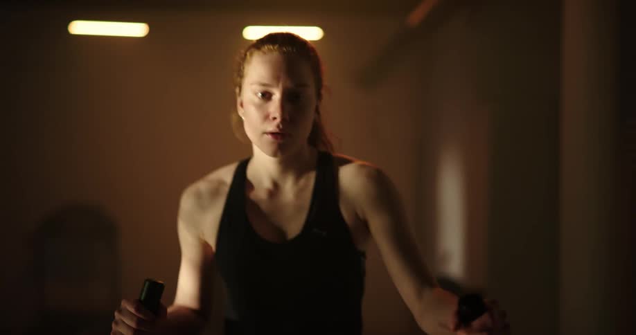 A young woman is working out at the gym