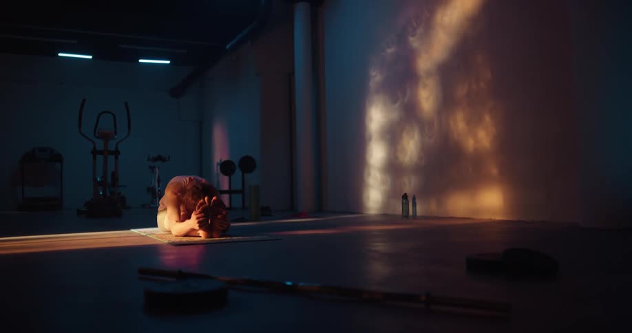 A woman stretching in a room