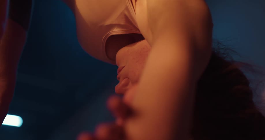 A female is bent over stretching