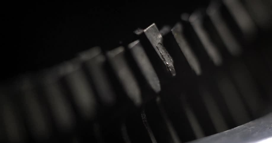 Typewriter strikers slam against paper