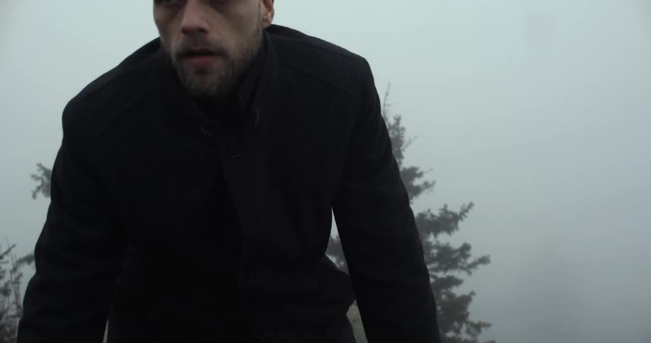 A bald man on top of a hill