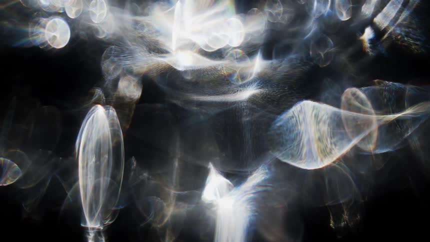 Smoke is twisting and trailing and forming shapes as it moves
