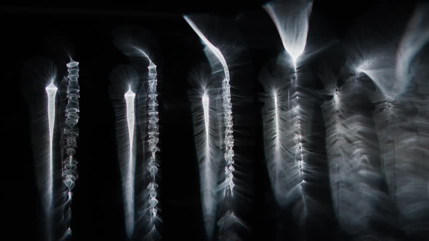 White glowing lights surrounded by darkness