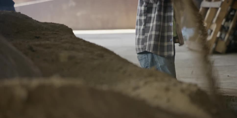 There are workers that are digging dirt