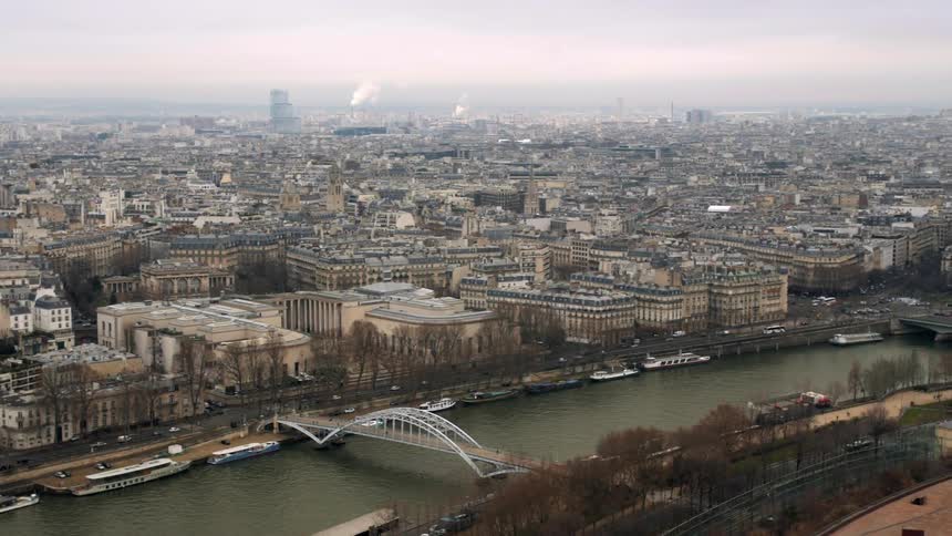 Aerial view of a river bordering a city