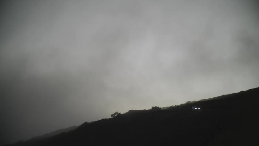 A car drives down a hill