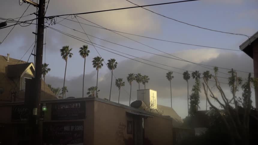 A street light is blinking in this town