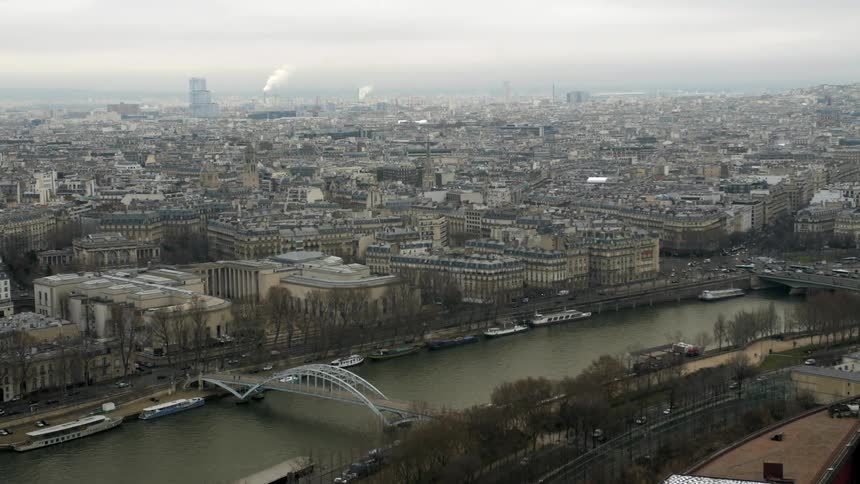 Cars drive along the street below in this city