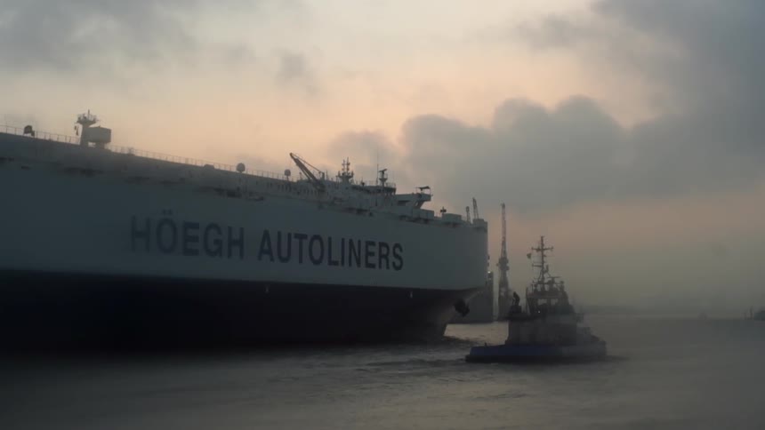 A large freight ship is sailing ahead