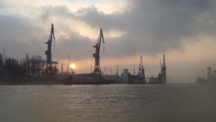 Clouds cover a harbor at sunset