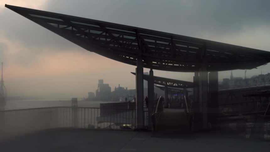 A city sits in the distance on a cloudy day