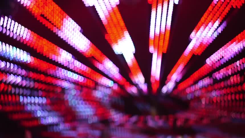 Lights shine on an amusement park ride