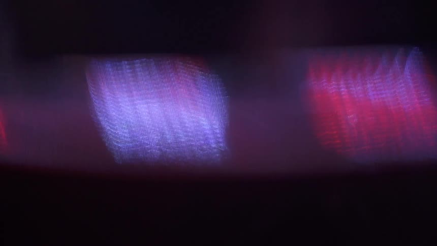 Blurry red and pink lights blinking