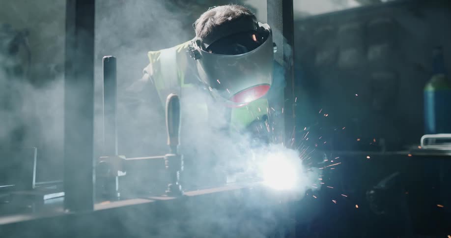 Sparks fly as a man welds