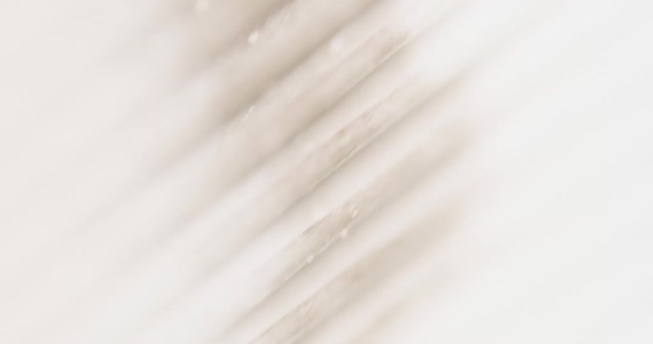 An object creates shadow lines against a white wall