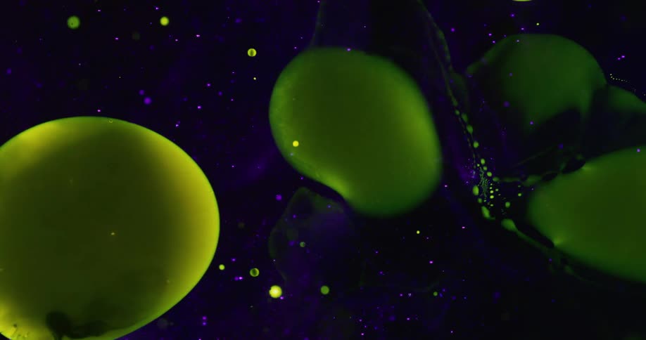 Jelly like green spheres float in a dark blue space