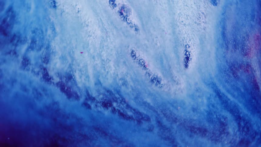 Waves of blue and white foam moving around