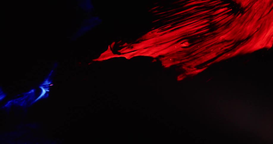 Two colored fabrics against a black background