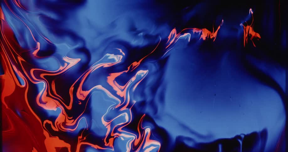 Swirling red and blue liquid