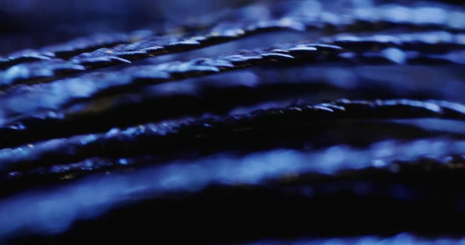 Black colored fibers shake in camera