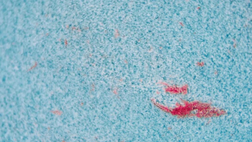 Red smear contrasts with white and blue textured mixture