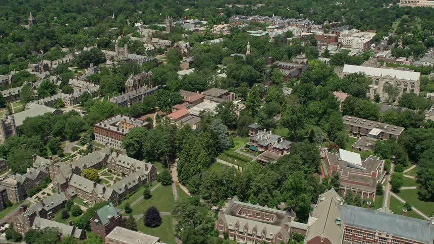 Aerial footage of buildings and greenery at Princeton University campus in New Jersey on a sunny day