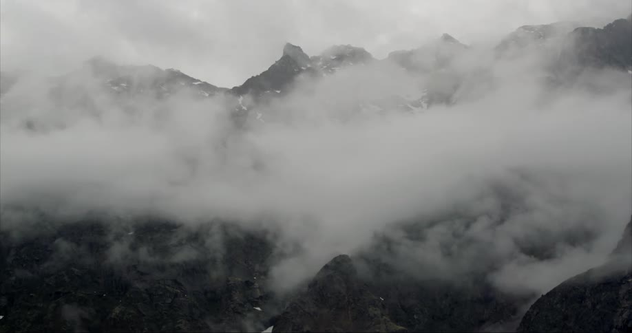 Heavy storm clouds swirl in the inhospitable weather of the polar regions in the Arctic