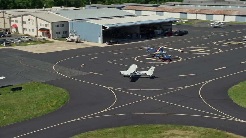 A small plane taxiing at Princeton Airport New Jersey on a sunny day in summer