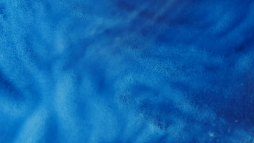 Blue particles shift under waves