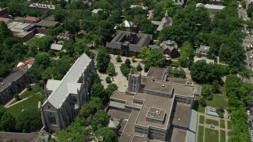 Aerial footage of Princeton University campus in New Jersey showcasing the Princeton University Chapel Firestone Library and campus halls during daytime