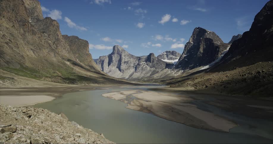 A river runs through Auyuittuq National Park with Mount Thor towering in the background