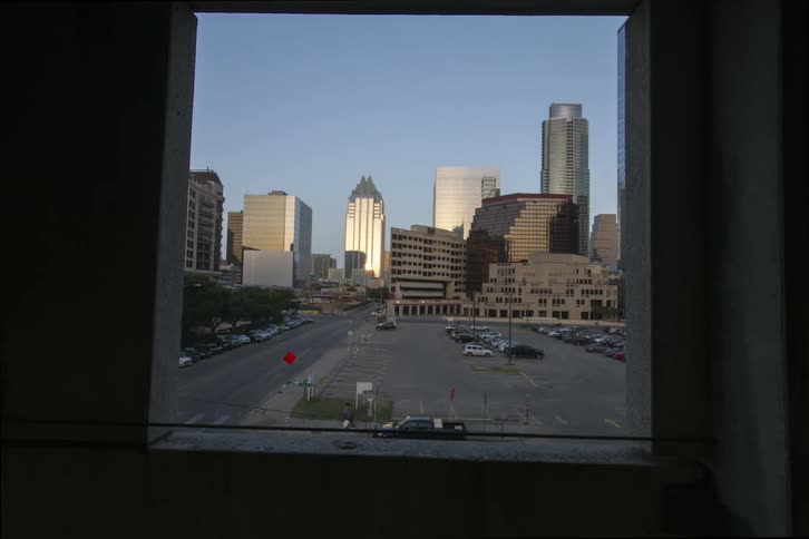Cars drive in a city