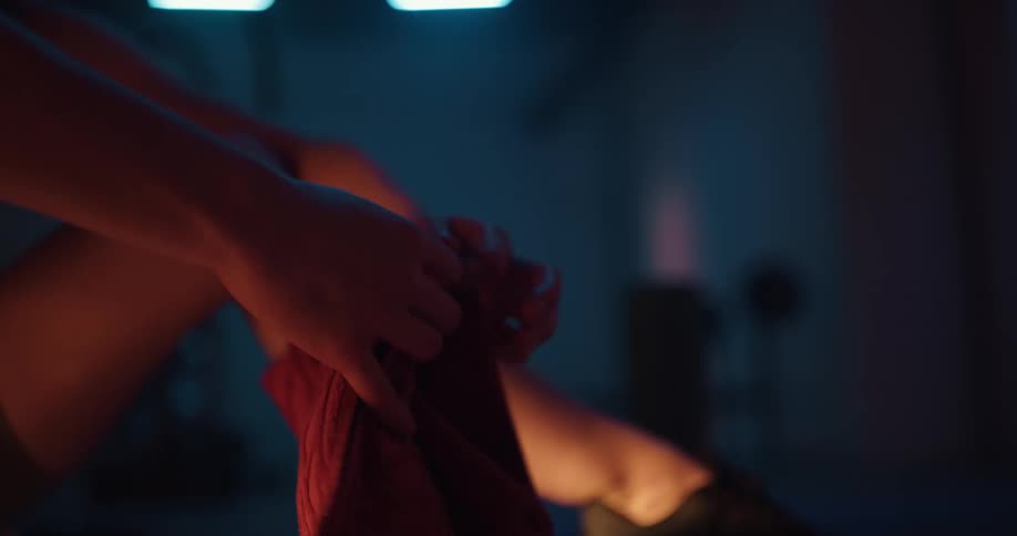 A person using a rag in a gym