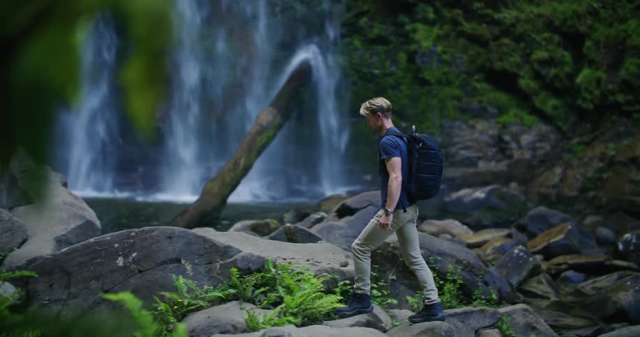 A man is hiking over the rocks