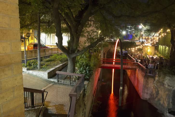 Time lapse of a city focused on a small bridge