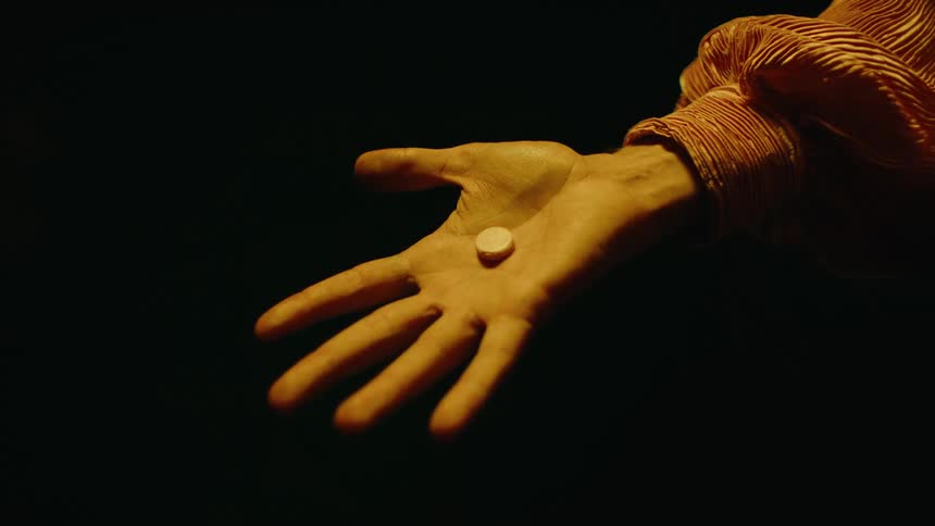 A person opens their hand and there is an object in it