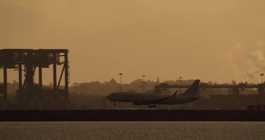 Plane landing behind haze
