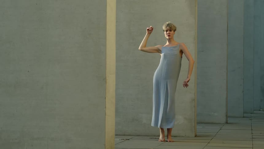 A woman dances outside