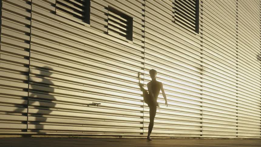 A dancer casts a shadow as he moves