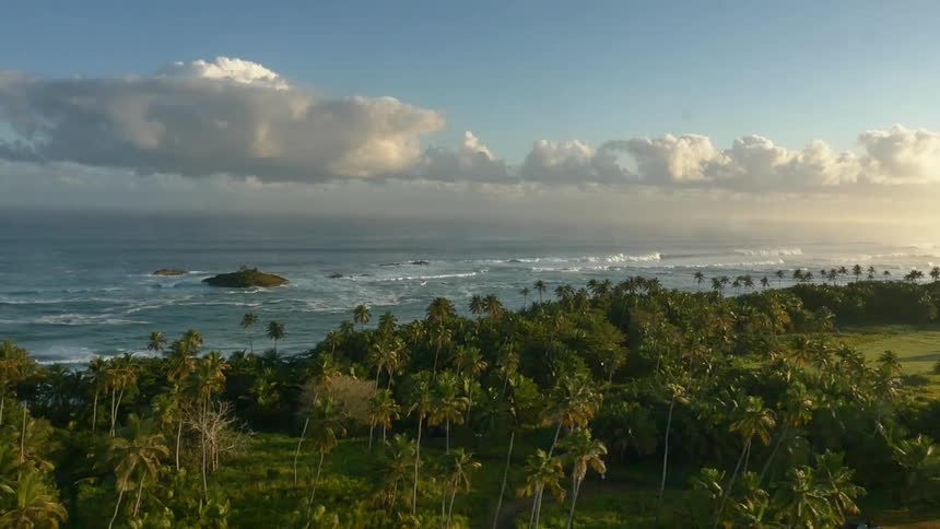 A tropical island on a partly cloudy day