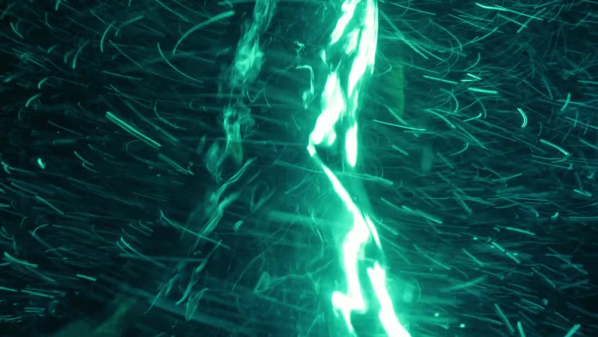 A twister turns in a green environment as glowing sparks rapidly spin around the vortex