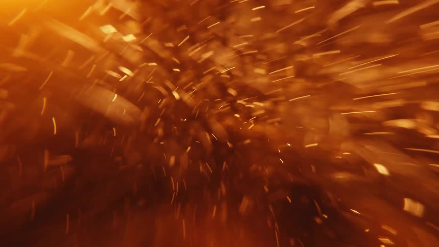 Orange sparks fly and expand