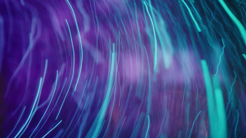Abstract blue and purple digital particles move in a circle