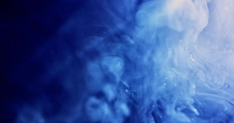 Blue billowing clouds with shimmering specks float up in waves