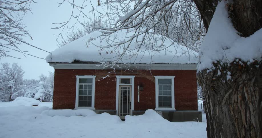 A view of a house covered in snow