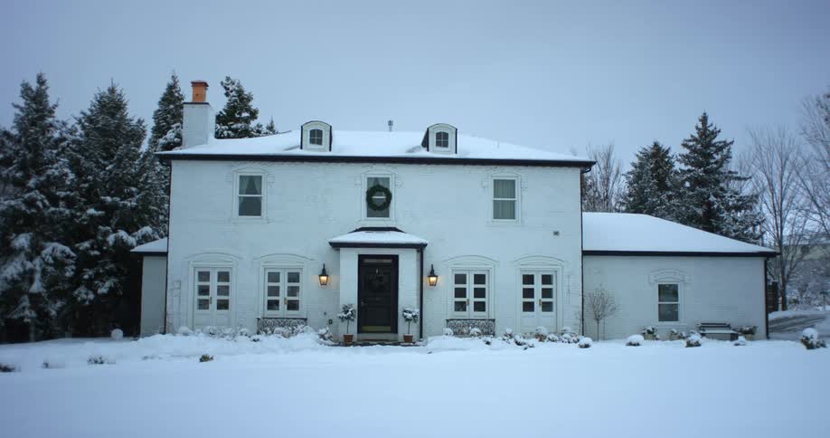 A view of a home covered in snow