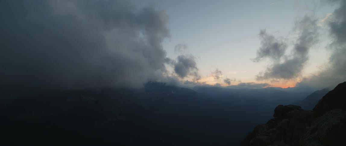 Dark storm clouds over a hill